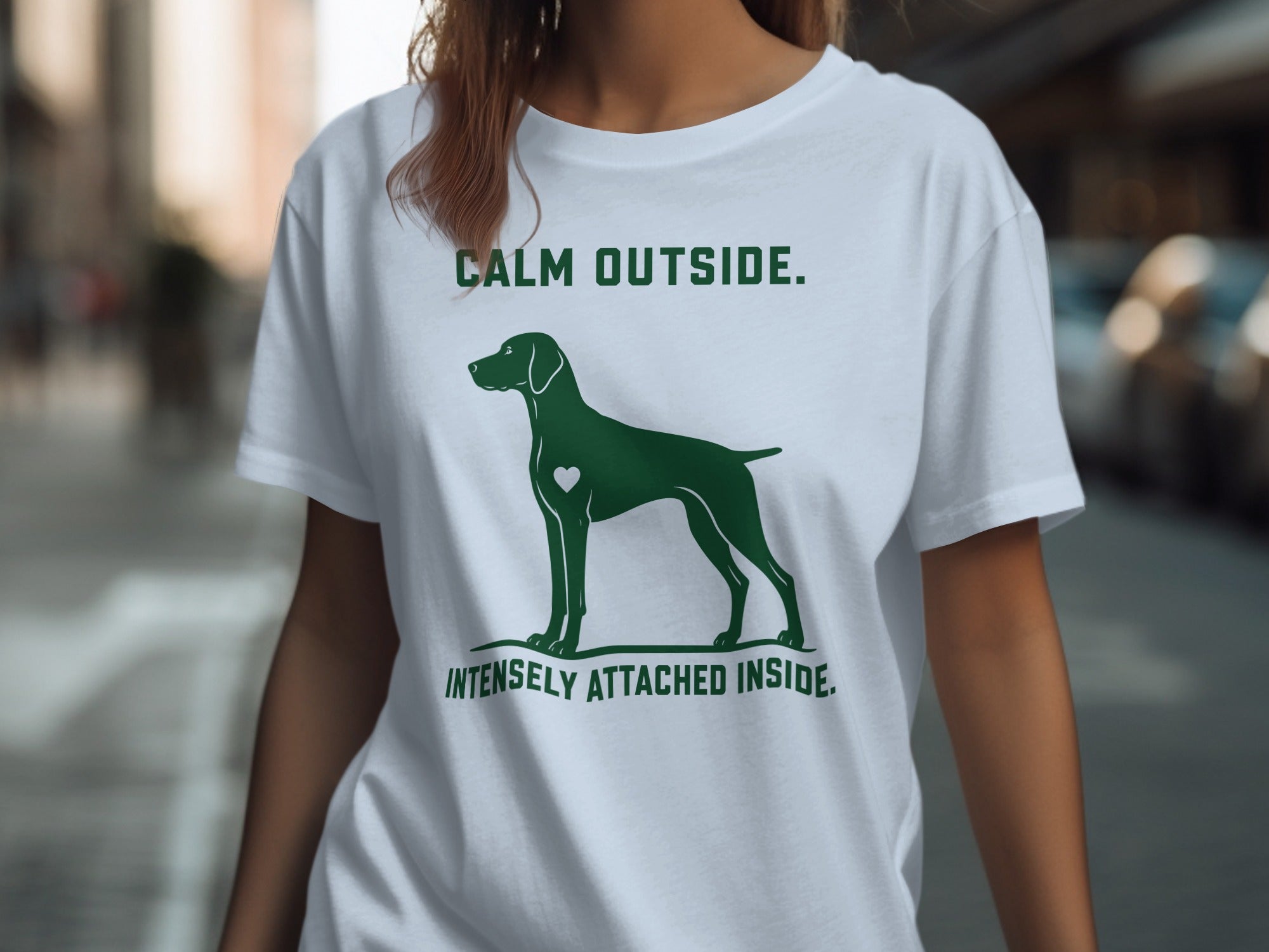 T-shirt with a dog silhouette and text "CALM OUTSIDE. INTENSELY ATTACHED INSIDE."