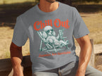 Gray t-shirt with a poodle wearing sunglasses in a lounge chair, holding a drink.