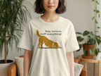 Tan t-shirt with golden dog illustration and text "Stay curious, Sniff everything!".