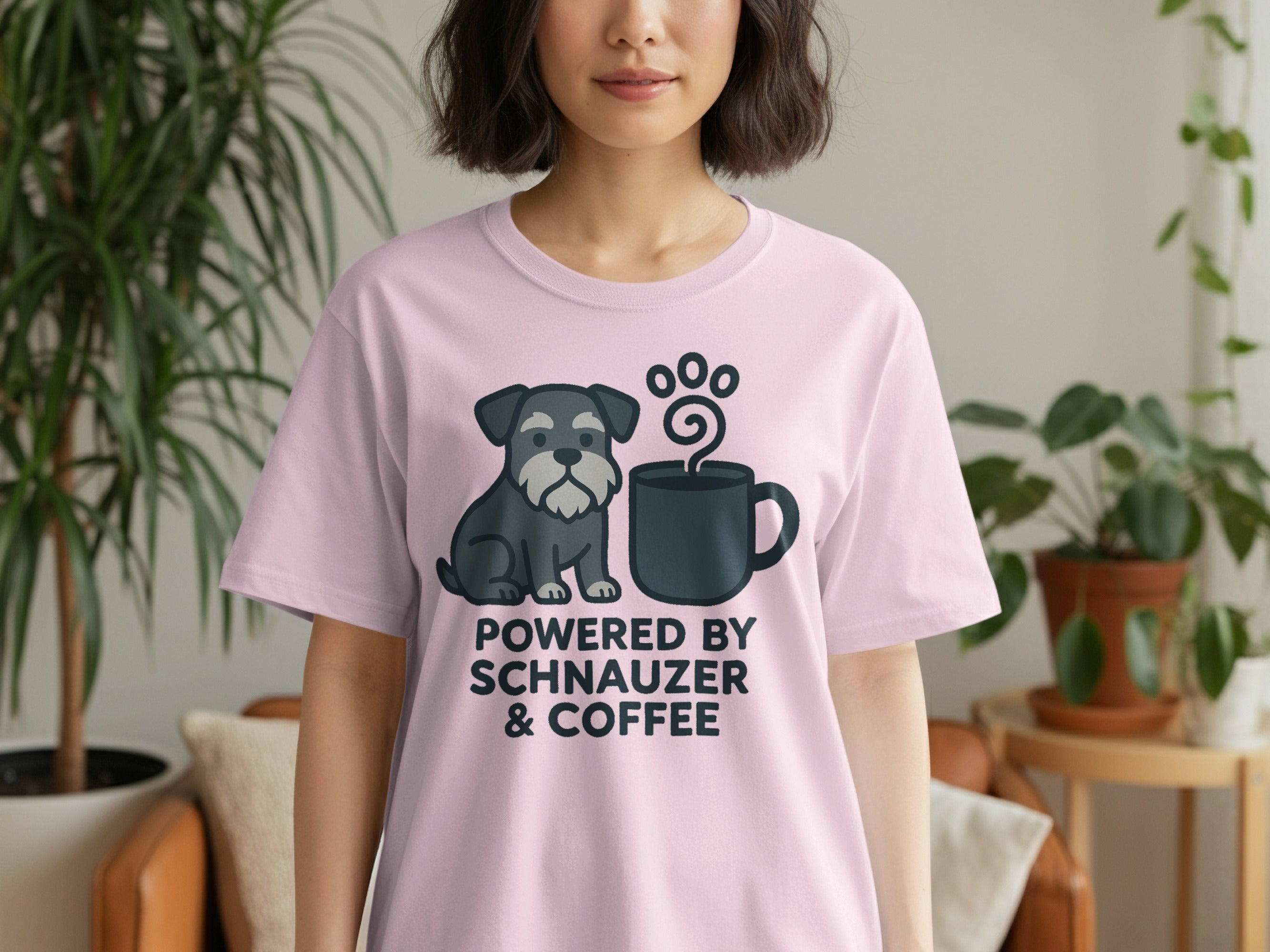 Pink t-shirt with a schnauzer and coffee mug graphic and text.