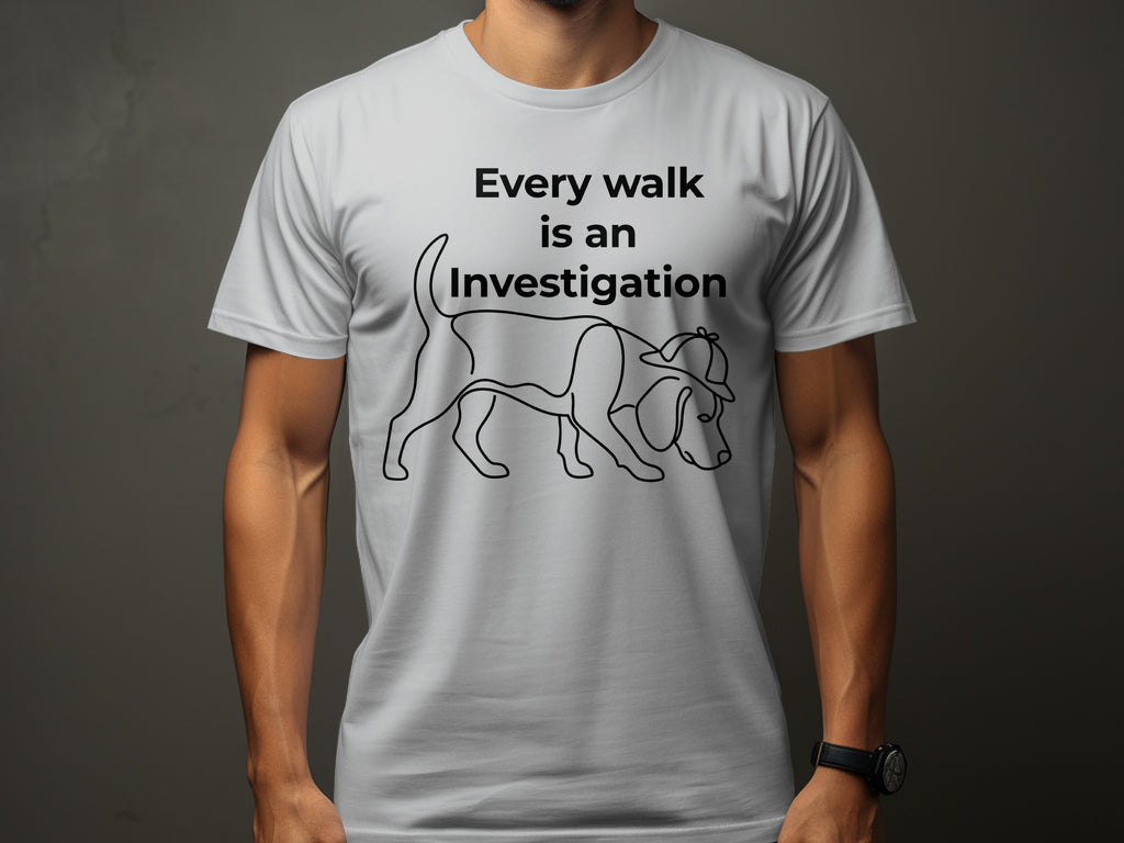 White t-shirt with a dog wearing a detective hat and the text "Every walk is an Investigation."