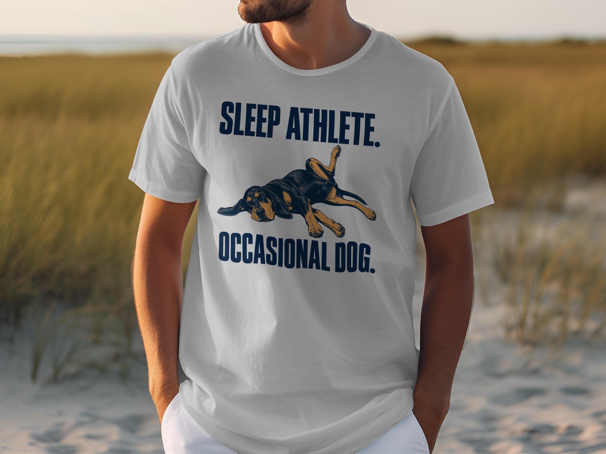 White t-shirt with "SLEEP ATHLETE. OCCASIONAL DOG." and a dog graphic.