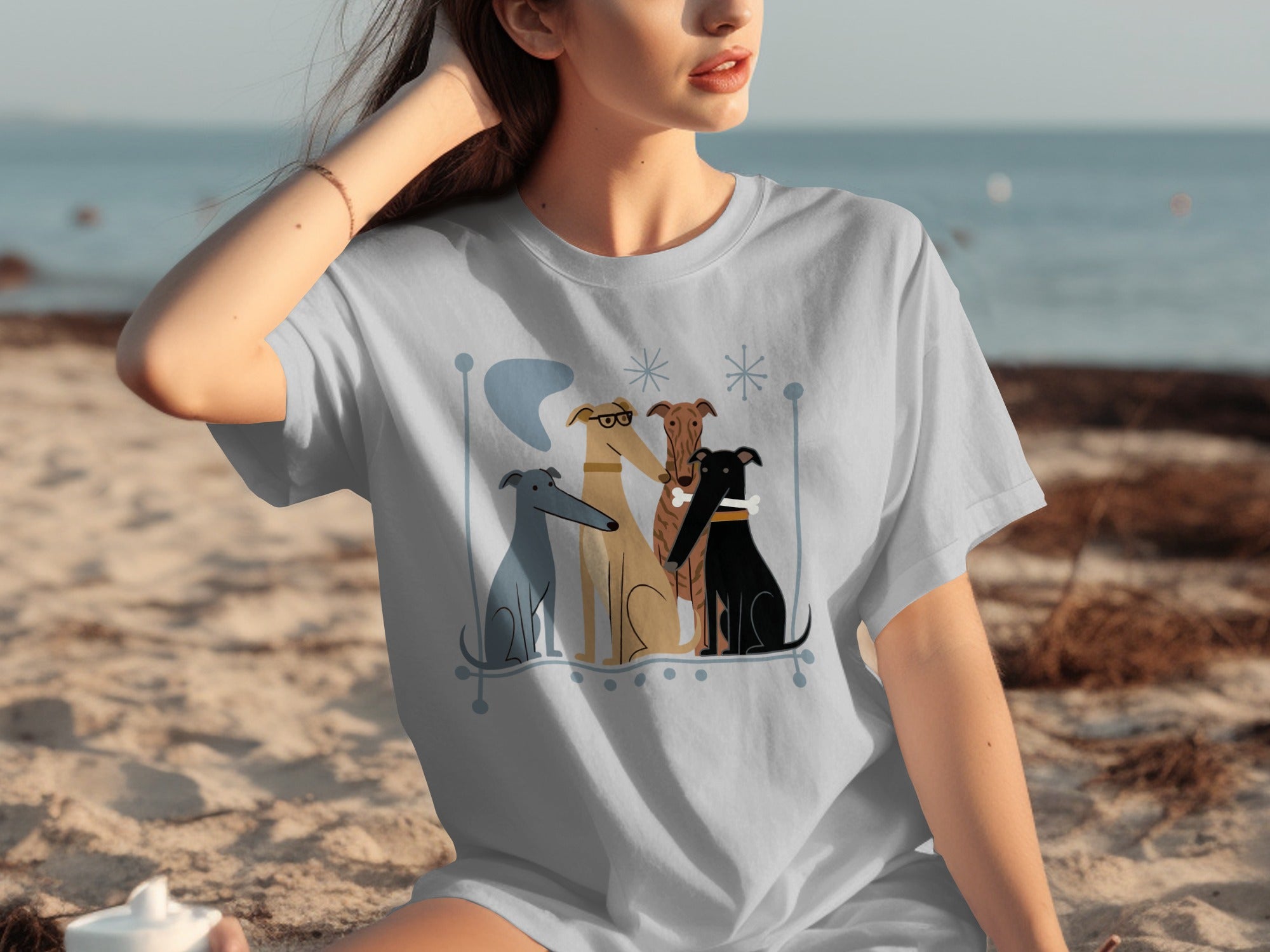 Four dogs illustrated on a light grey t-shirt.