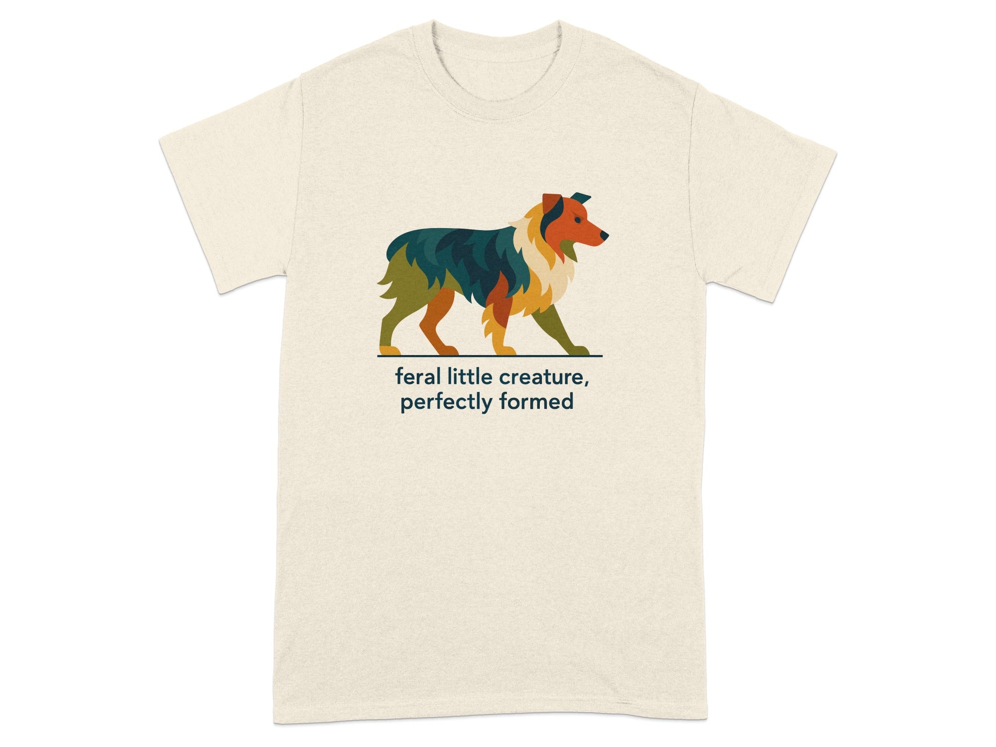 Cream t-shirt with a colorful abstract dog illustration and "feral little creature, perfectly formed" text.