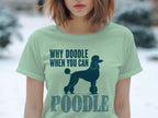 Light green t-shirt with a dark blue poodle silhouette and text "WHY DOODLE WHEN YOU CAN POODLE".