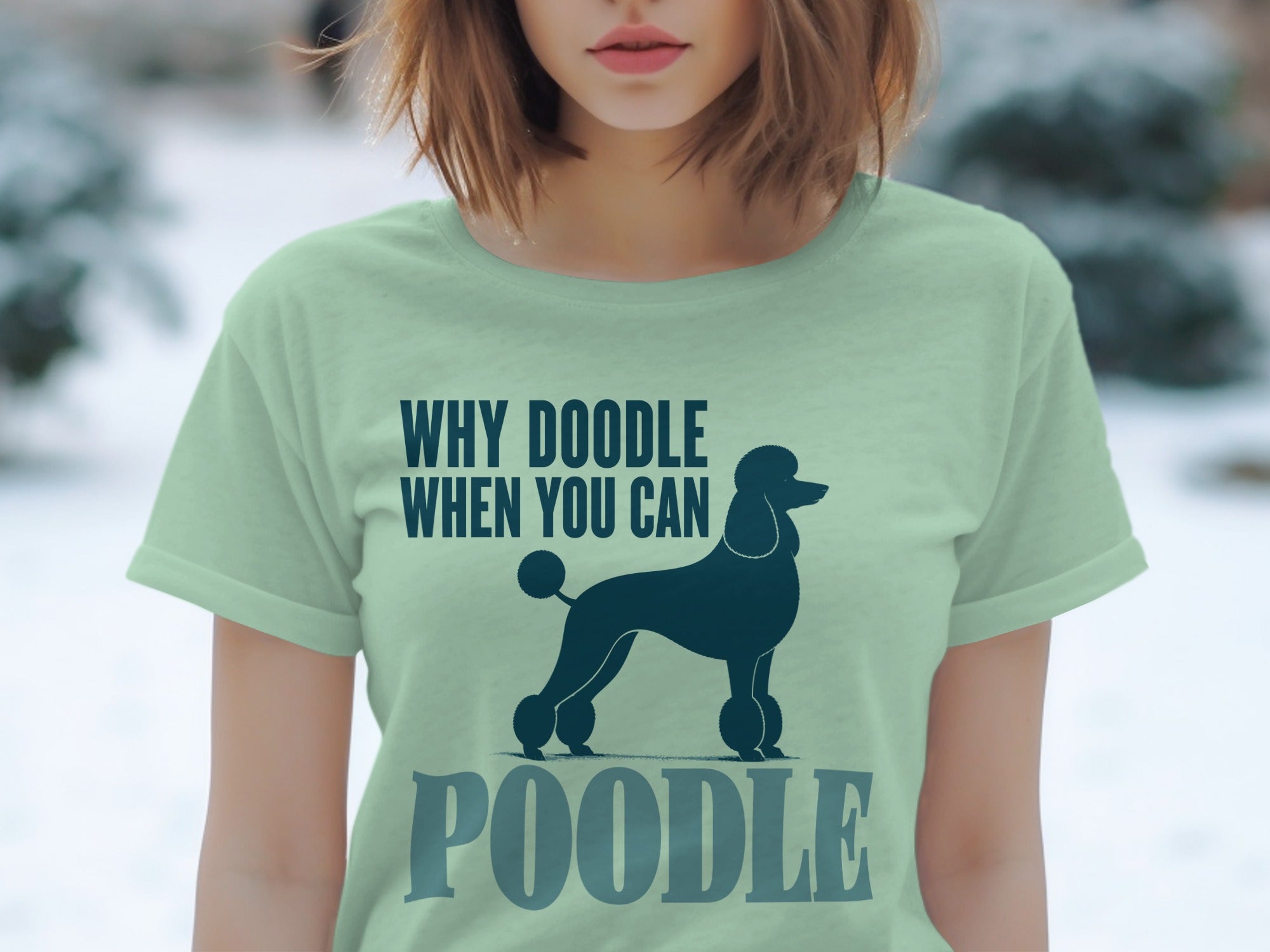 Light green t-shirt with a dark blue poodle silhouette and text "WHY DOODLE WHEN YOU CAN POODLE".