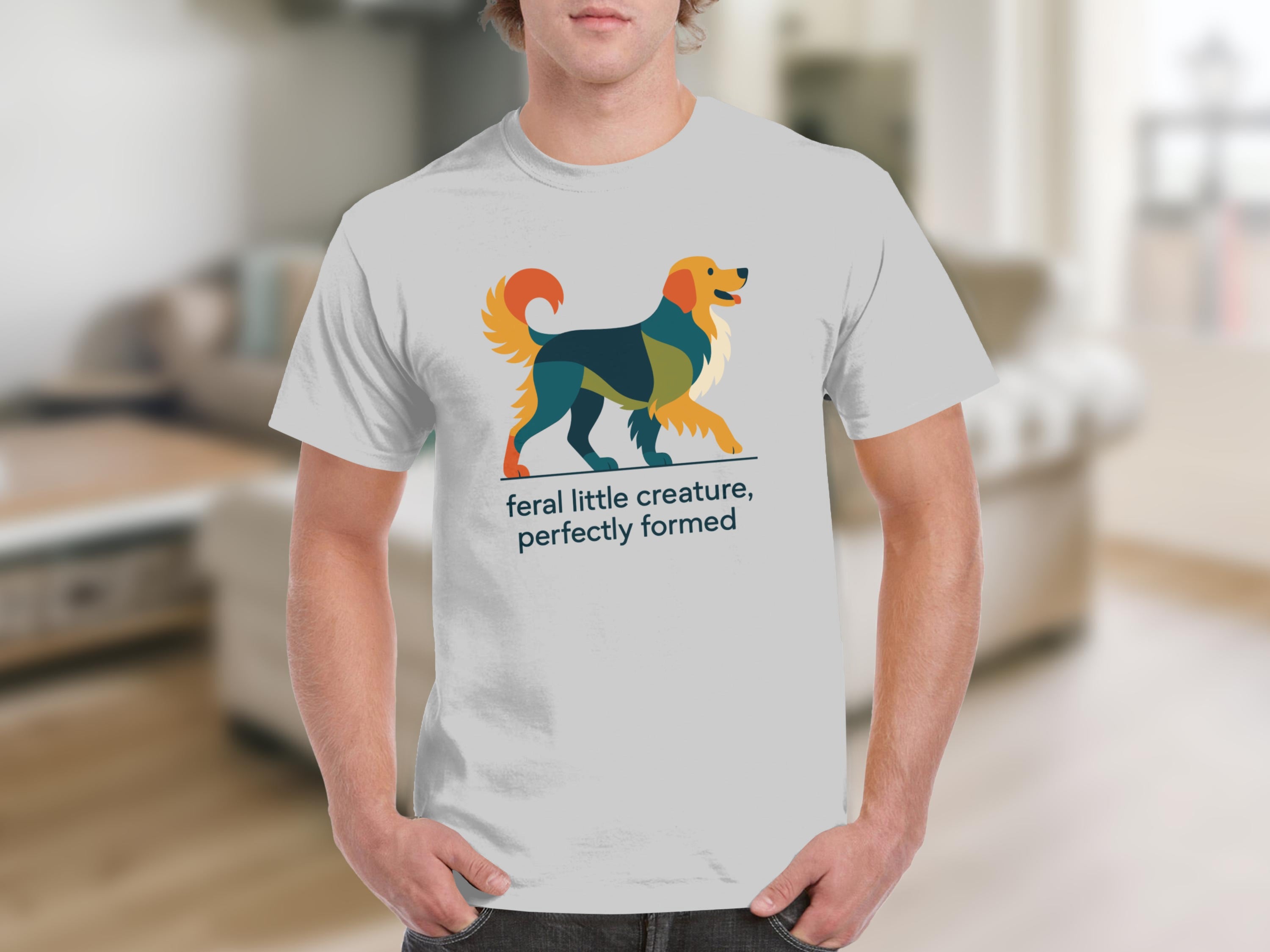 White t-shirt with a geometric dog design and text "feral little creature, perfectly formed."