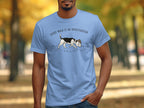 Light blue t-shirt with a dog sniffing the ground, text reads "Every walk is an investigation".
