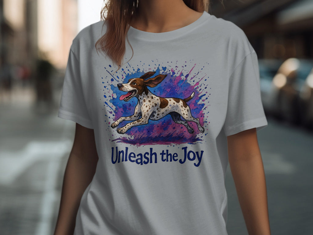 T-shirt with a running dog graphic and the text "Unleash the Joy."