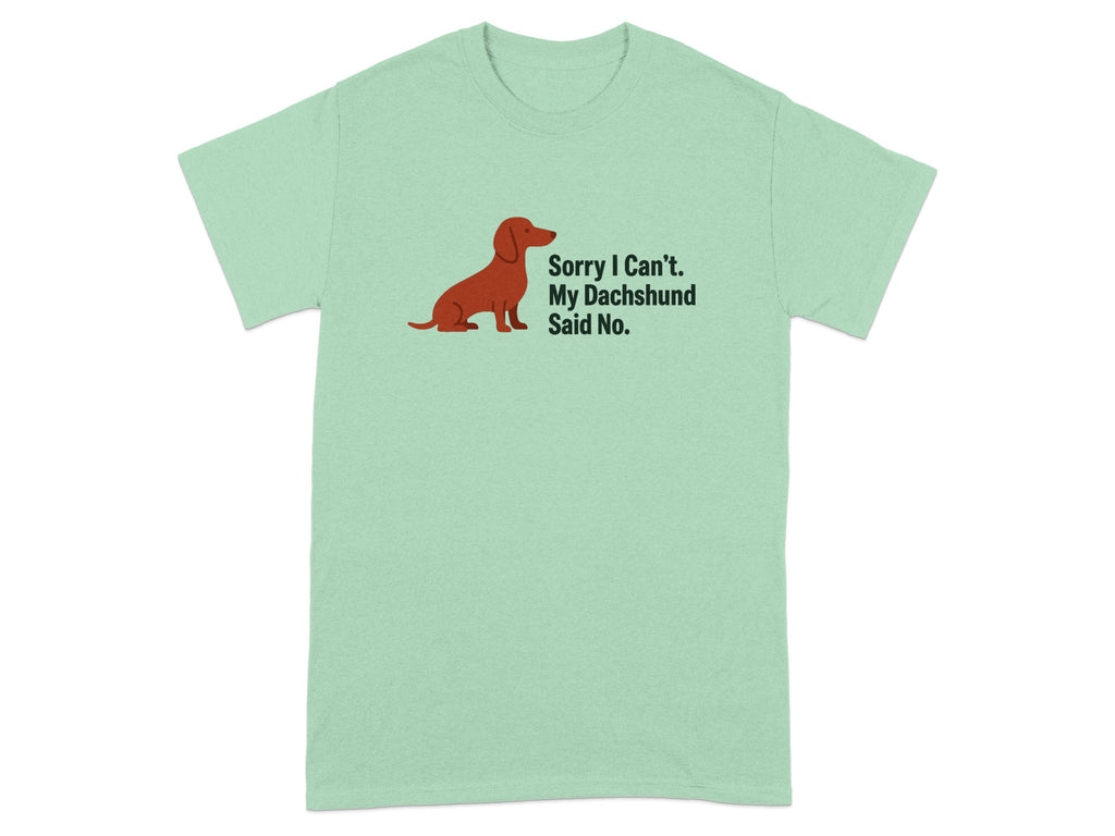 Light green t-shirt with a brown dachshund illustration and text reading "Sorry I Can't. My Dachshund Said No."