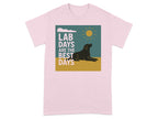 Pink t-shirt with a graphic of a black lab, sun, and clouds, reading "LAB DAYS ARE THE BEST DAYS".