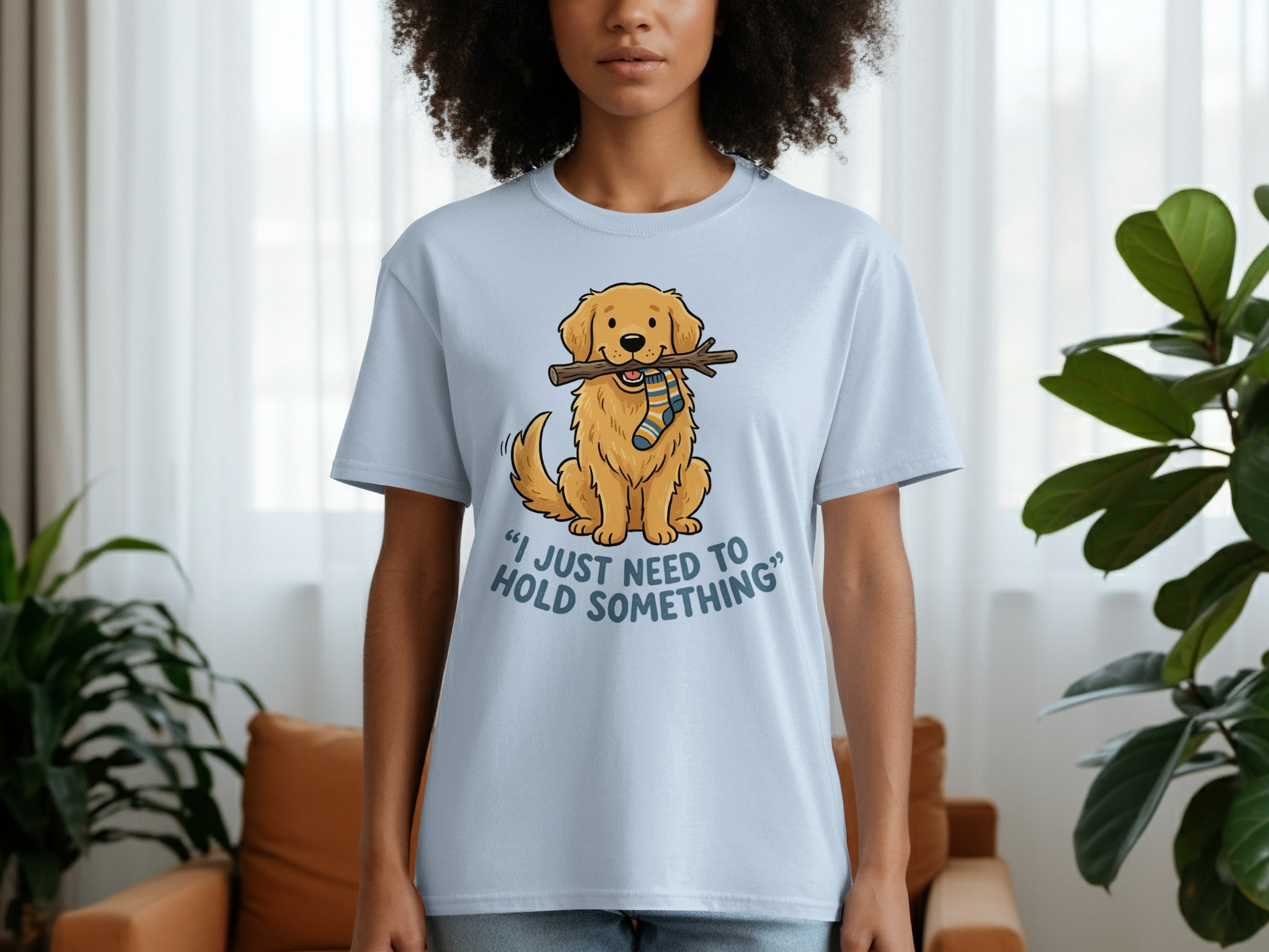 Light blue t-shirt with cartoon dog holding a stick with striped sock.