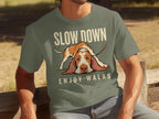 T-shirt with a sad Basset Hound and text "SLOW DOWN ENJOY WALKS".
