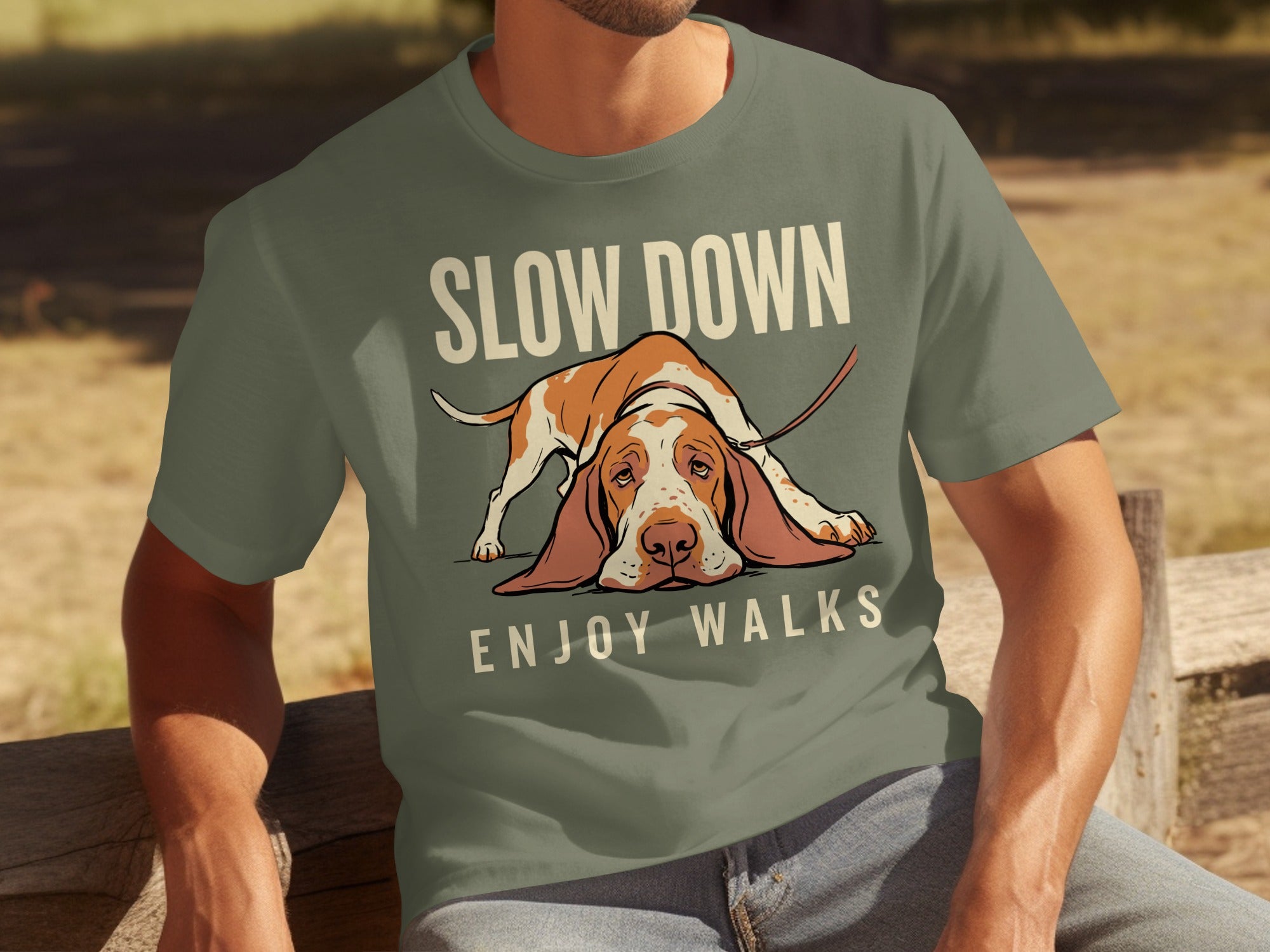 T-shirt with a sad Basset Hound and text "SLOW DOWN ENJOY WALKS".