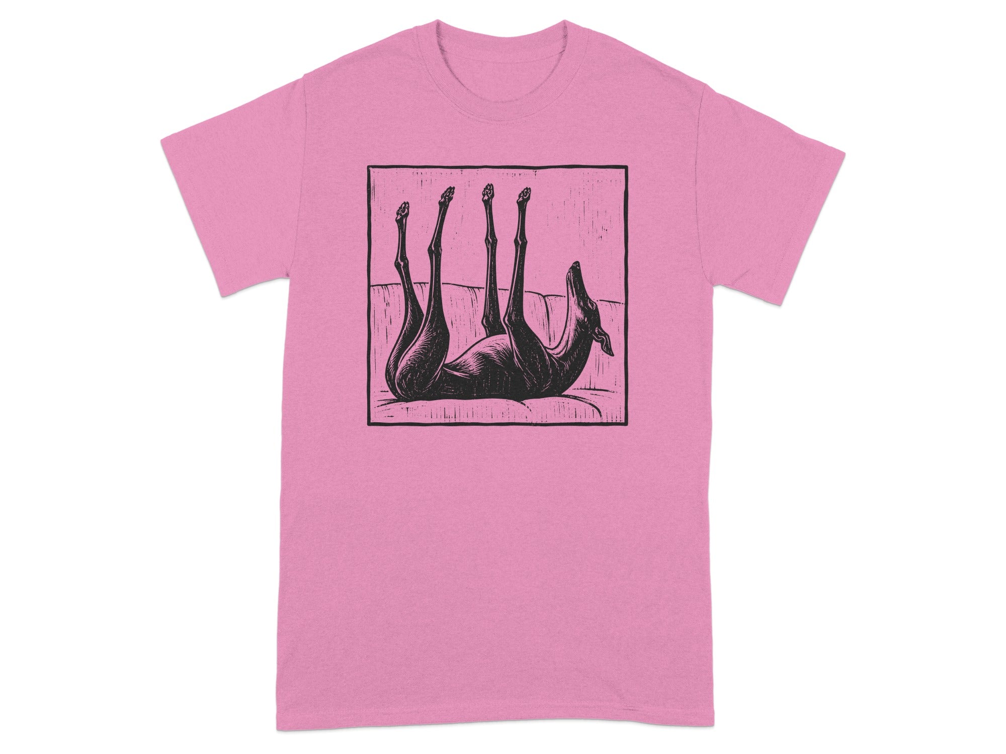 Black linocut-style illustration of a dog lounging on its back on a pink t-shirt.