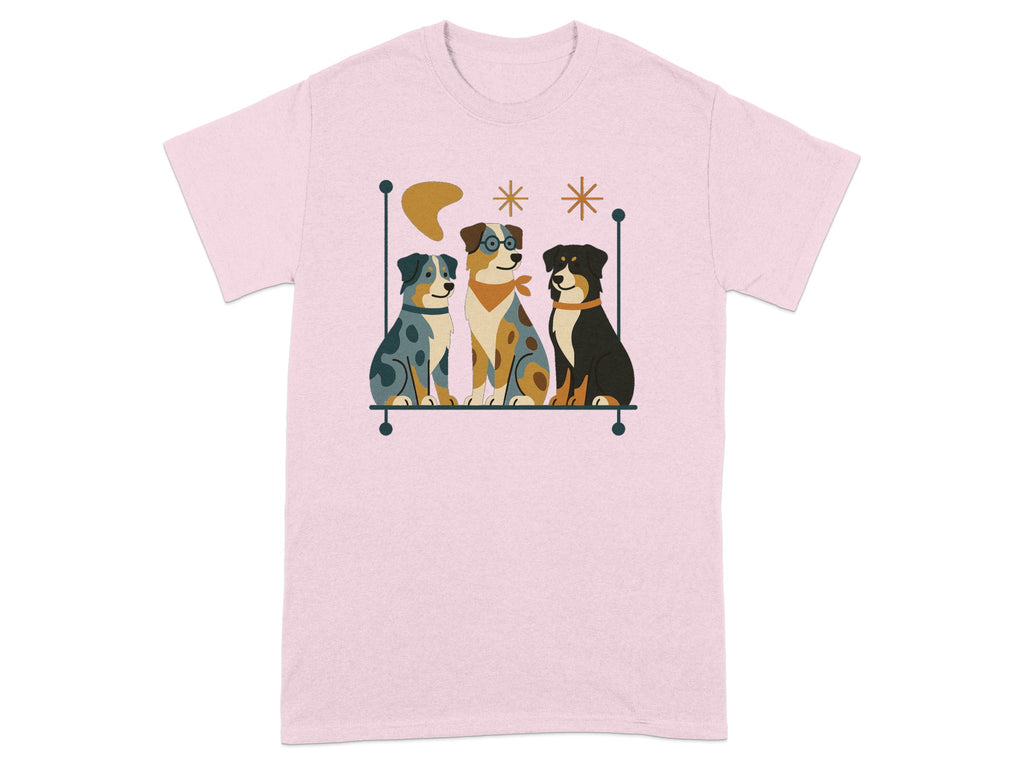 Three dogs, one wearing glasses, sit in a minimalist graphic on a pink t-shirt.