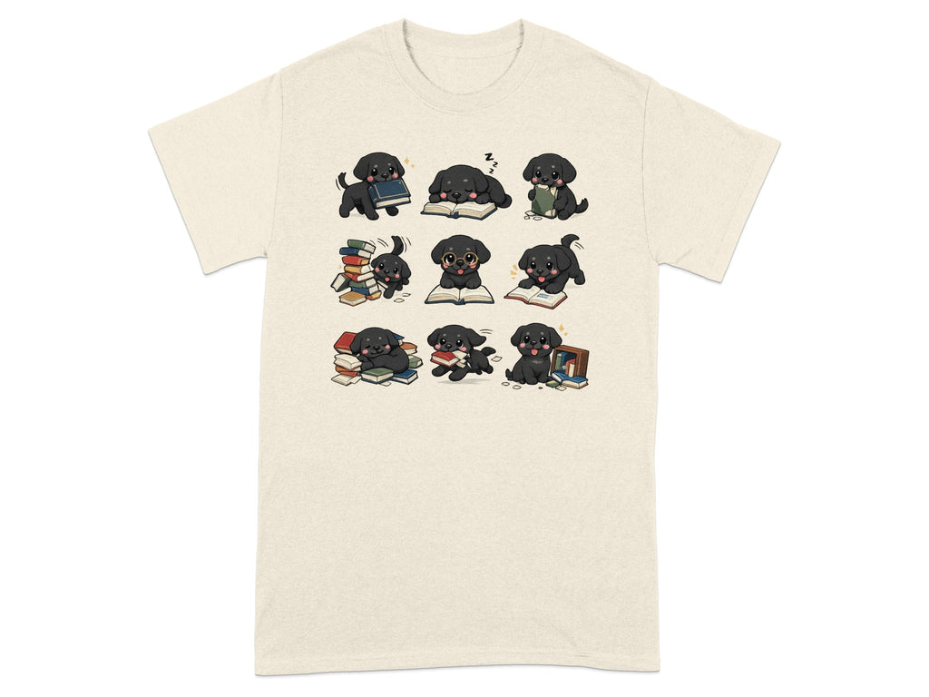 Nine illustrated black puppies interact with piles of books on a cream t-shirt.