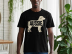 Black t-shirt with a cream silhouette of a dog and the word "AUSSIE".
