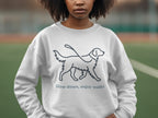 White sweatshirt with a line drawing of a dog and text "Slow down, enjoy walks".