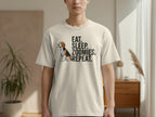 Beige t-shirt with "EAT. SLEEP. ZOOMIES. REPEAT." and a beagle.