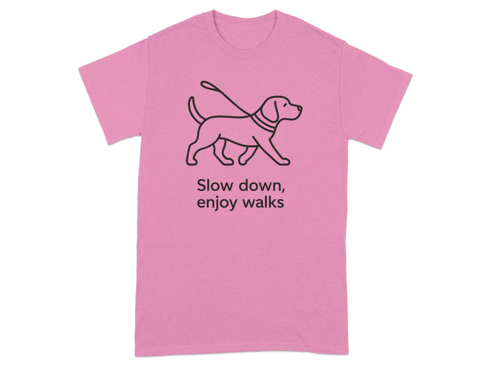 Pink t-shirt with a line drawing of a dog on a leash and text "Slow down, enjoy walks".