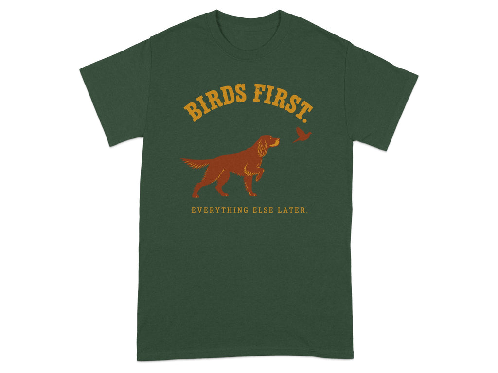 Dark green t-shirt with "BIRDS FIRST. EVERYTHING ELSE LATER." and a dog and bird graphic.