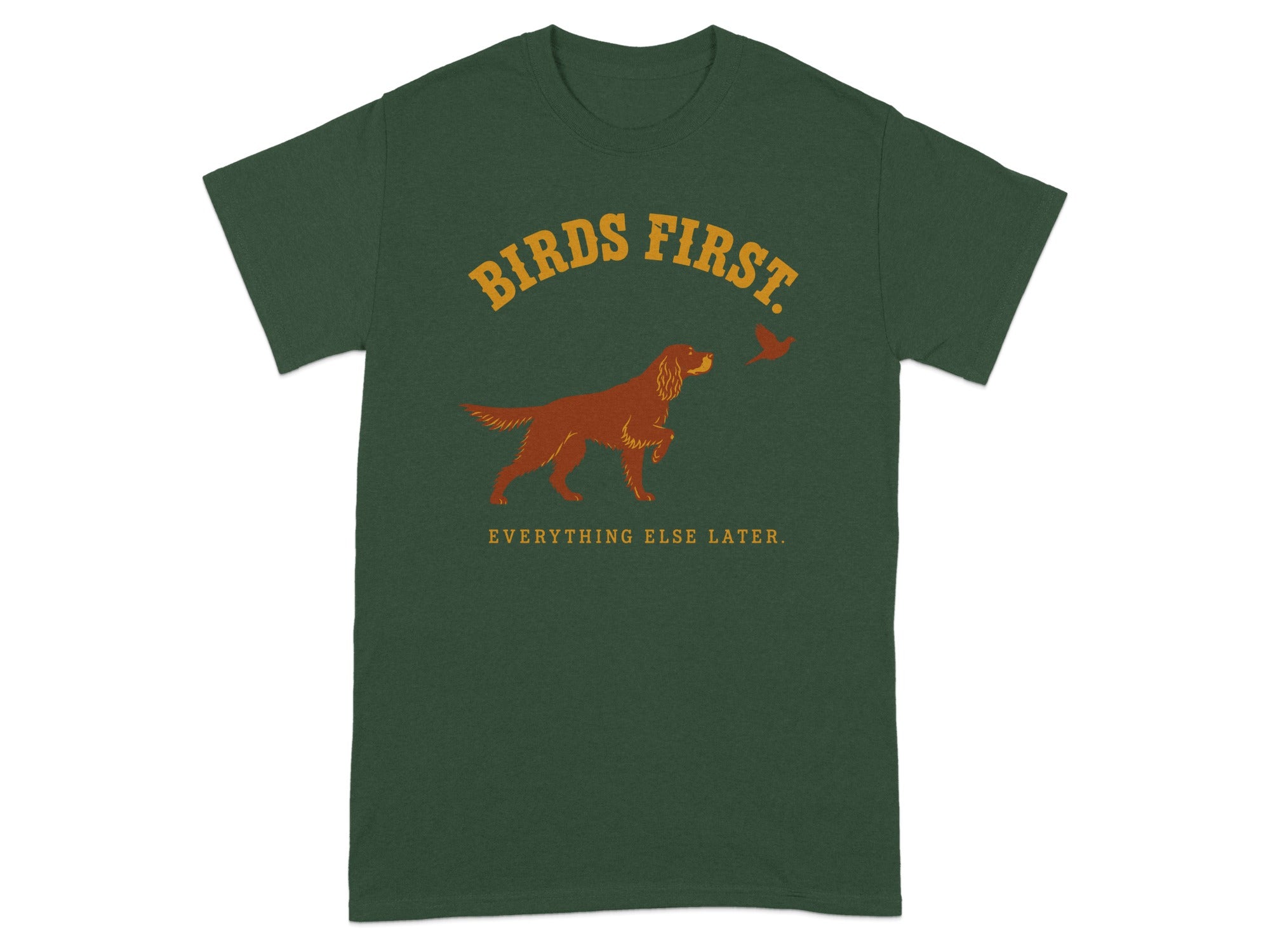 Dark green t-shirt with "BIRDS FIRST. EVERYTHING ELSE LATER." and a dog and bird graphic.