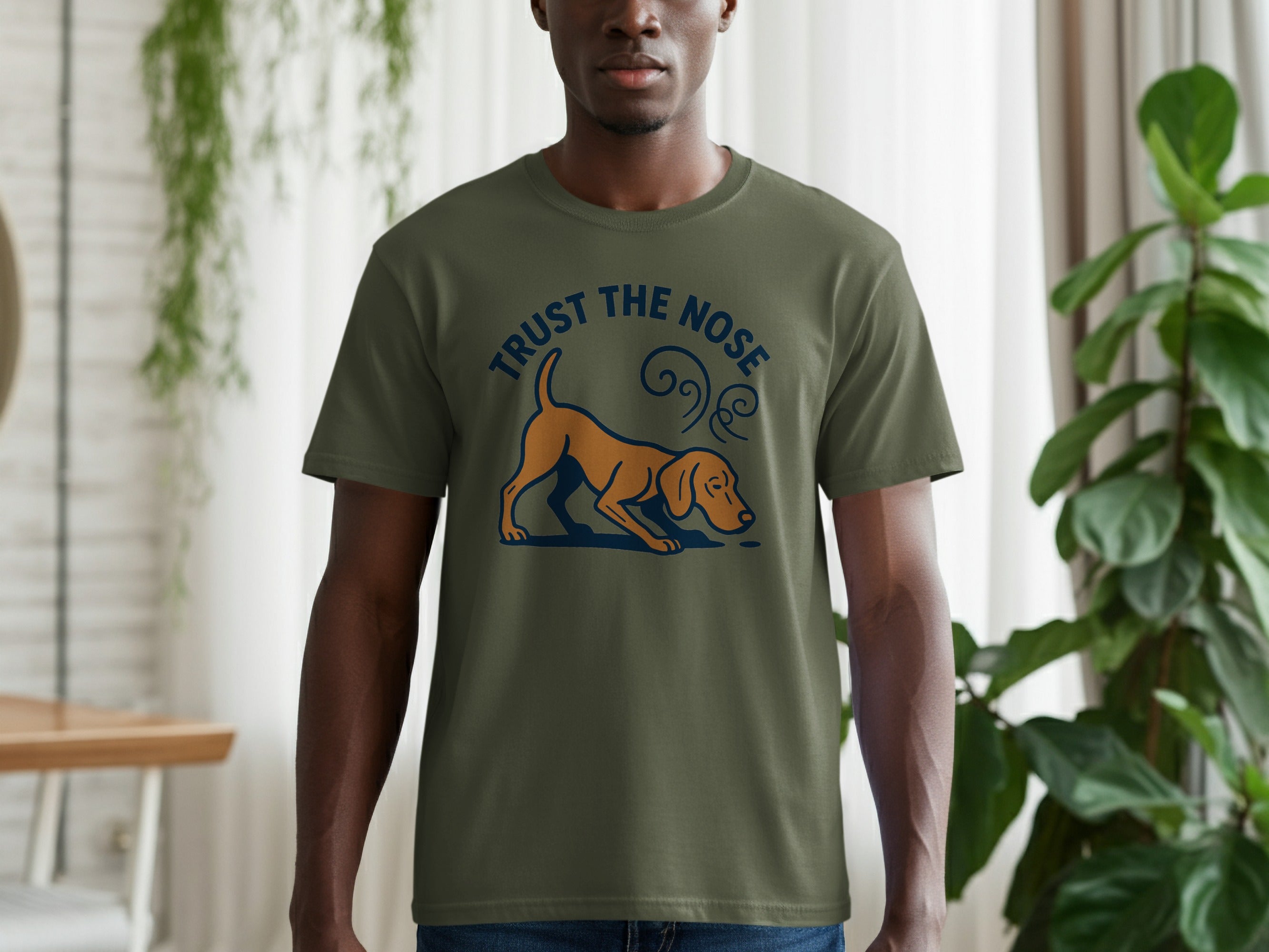 Green t-shirt with "TRUST THE NOSE" and a dog sniffing design.