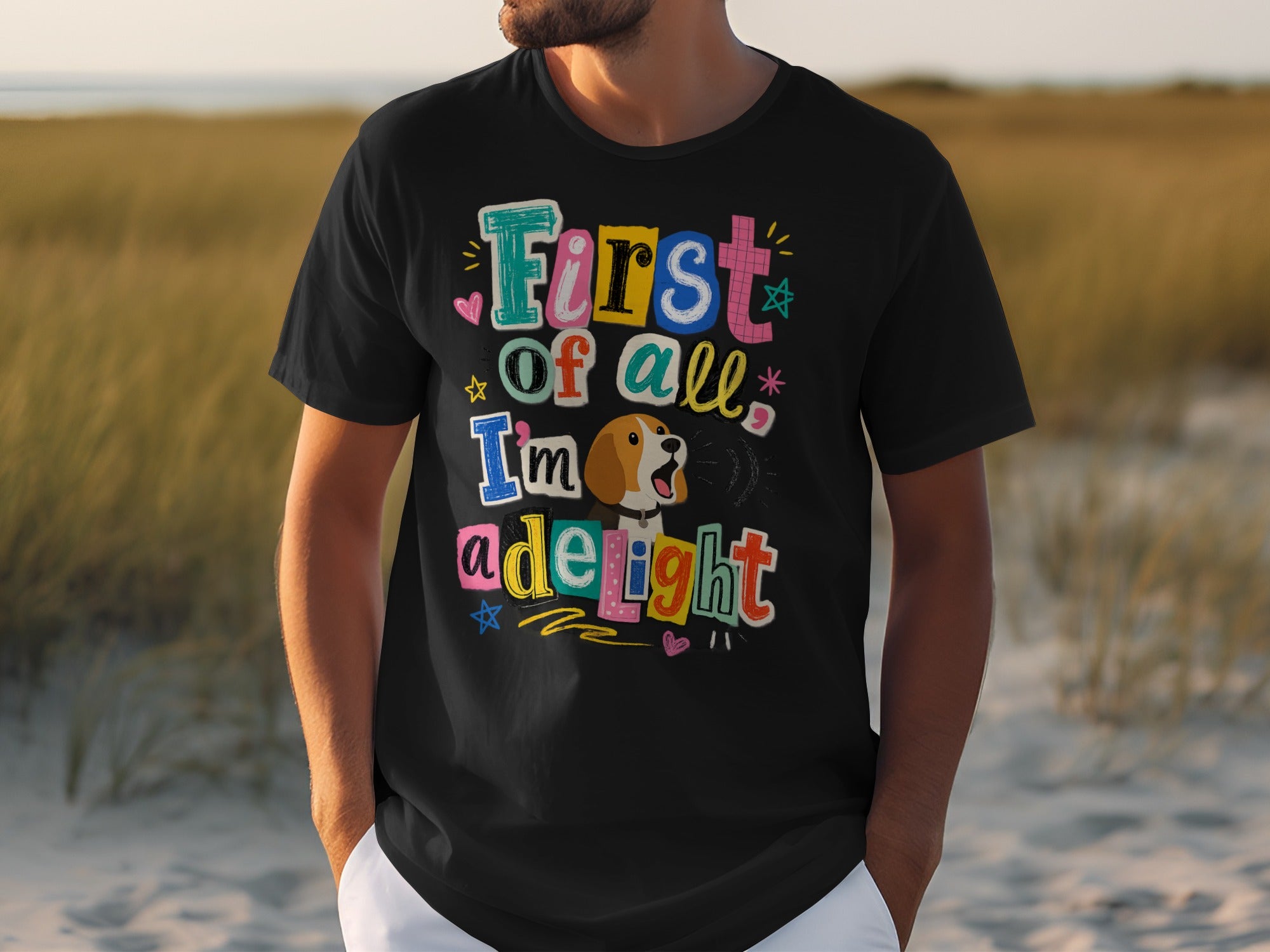 Black t-shirt with colorful "First of all, I'm a delight" text and cartoon dog.