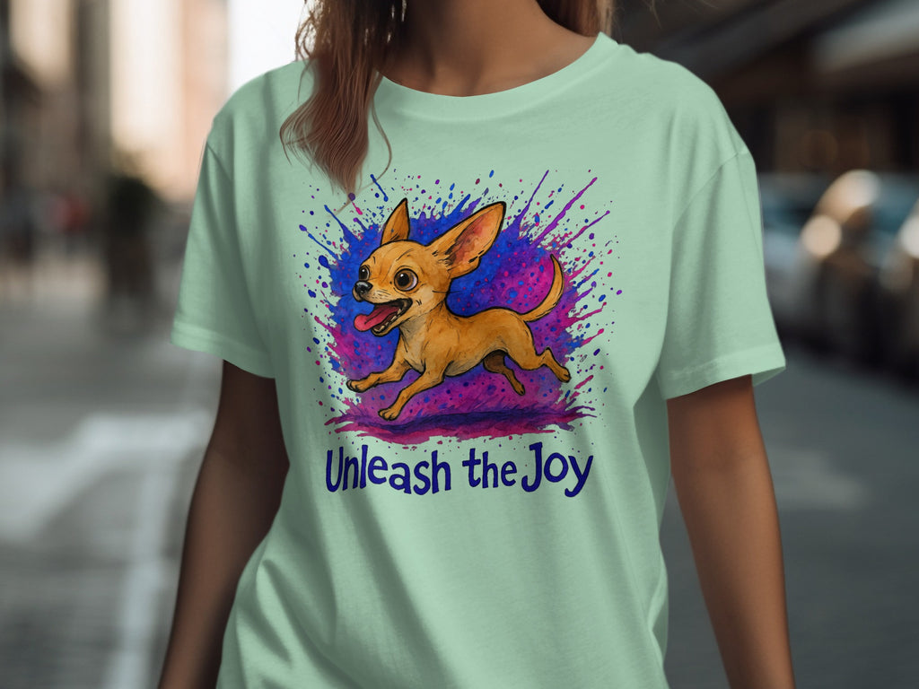 Light green t-shirt with a cartoon chihuahua and "Unleash the Joy" text.