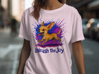 Light pink t-shirt with a chihuahua graphic and the text "Unleash the Joy".