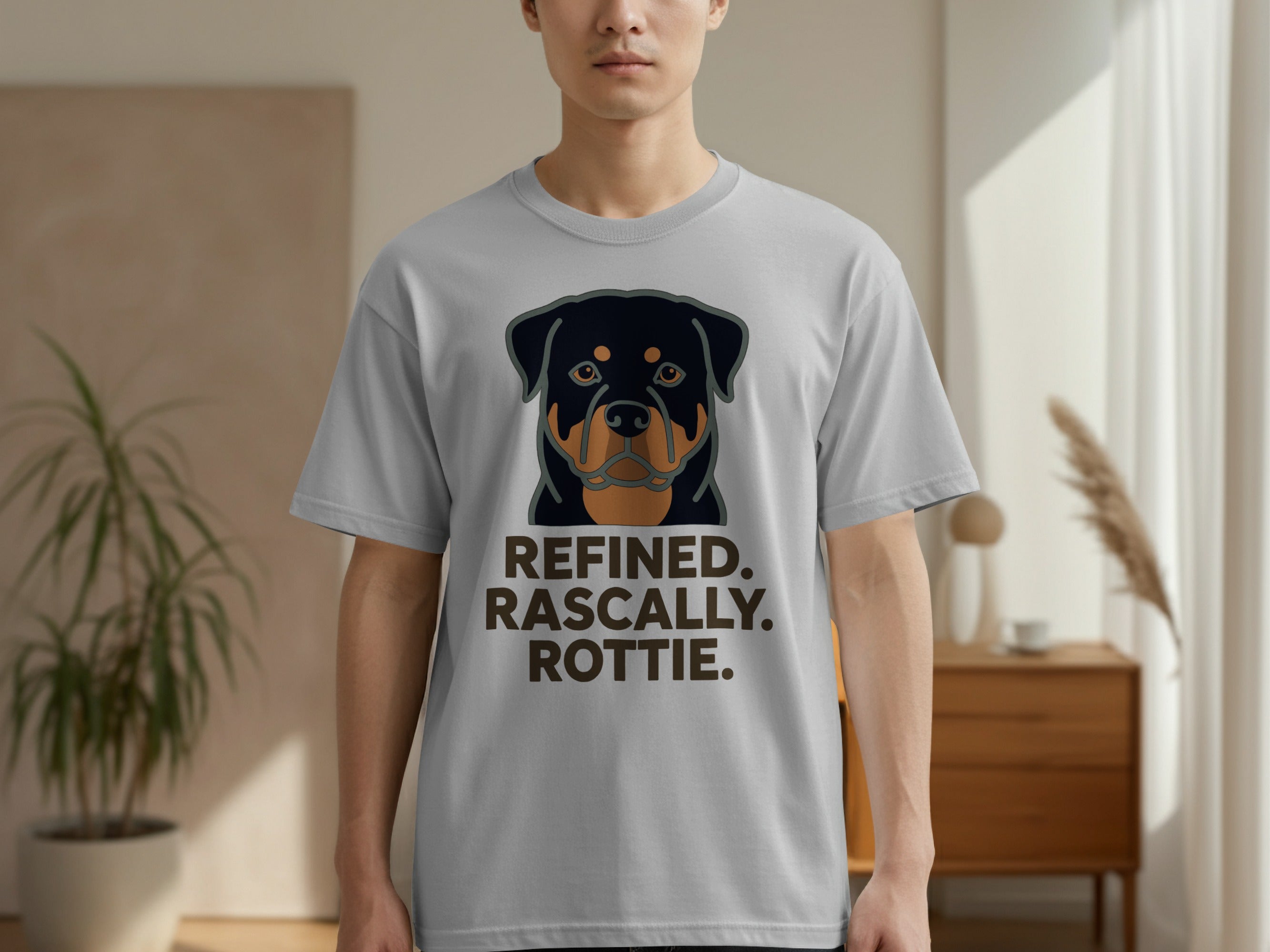 T-shirt with a Rottweiler graphic and text "REFINED. RASCALLY. ROTTIE."