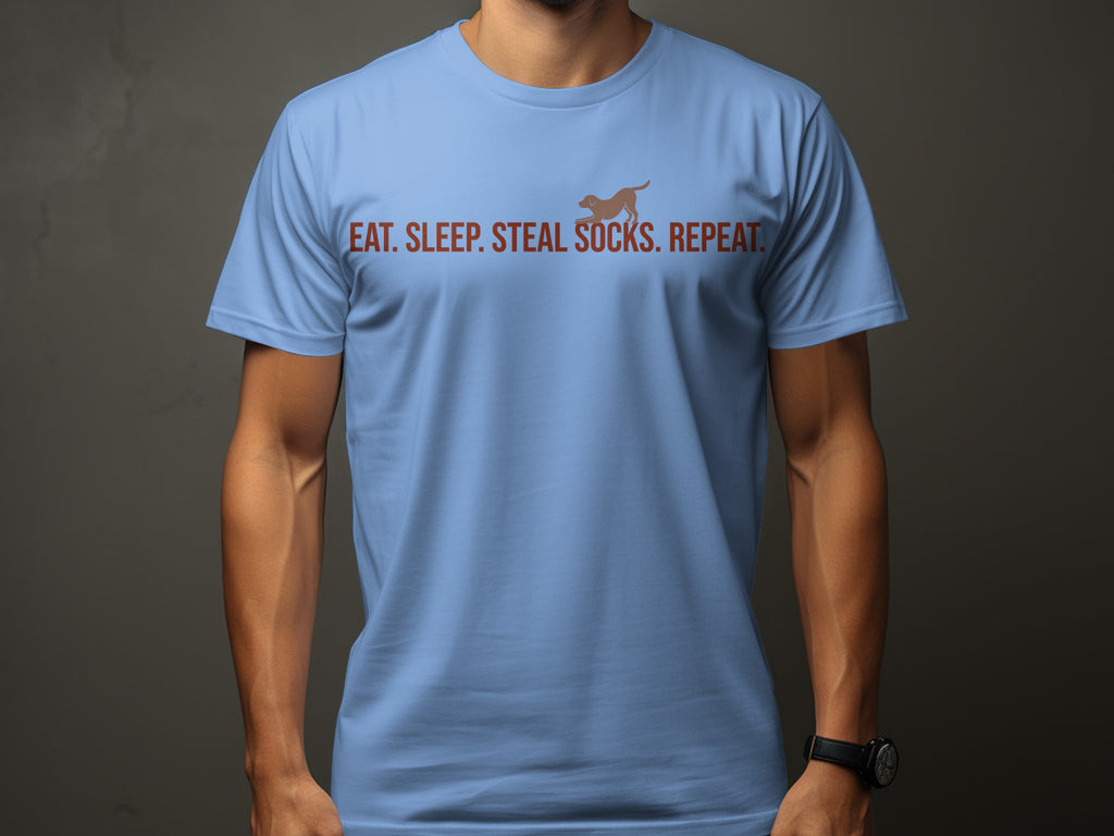 Light blue t-shirt with "Eat. Sleep. Steal. Socks. Repeat." and a dog silhouette.