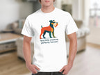 White t-shirt with abstract dog graphic and text "feral little creature, perfectly formed".