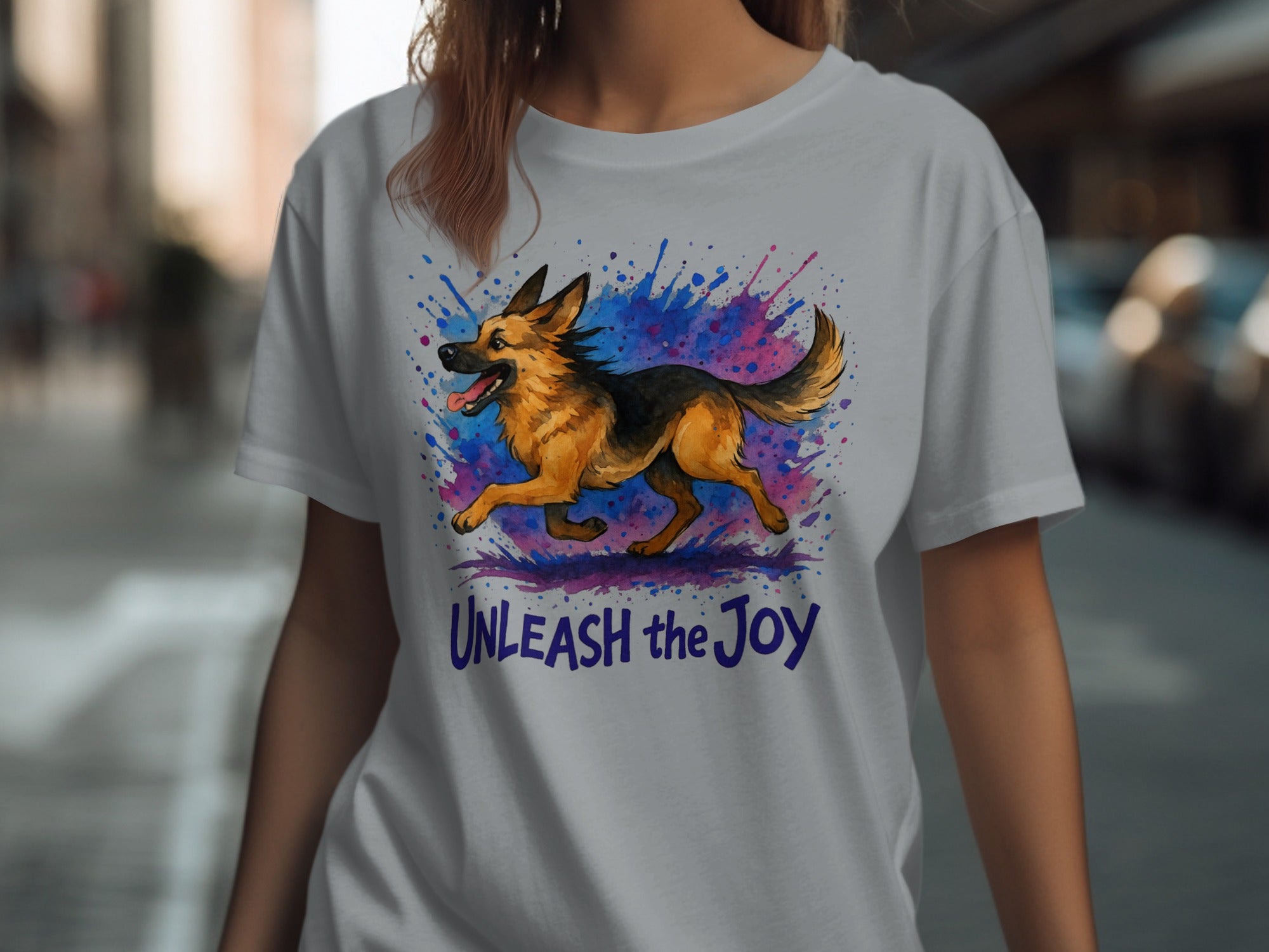 German Shepherd running with colorful splashes and text "UNLEASH the Joy".