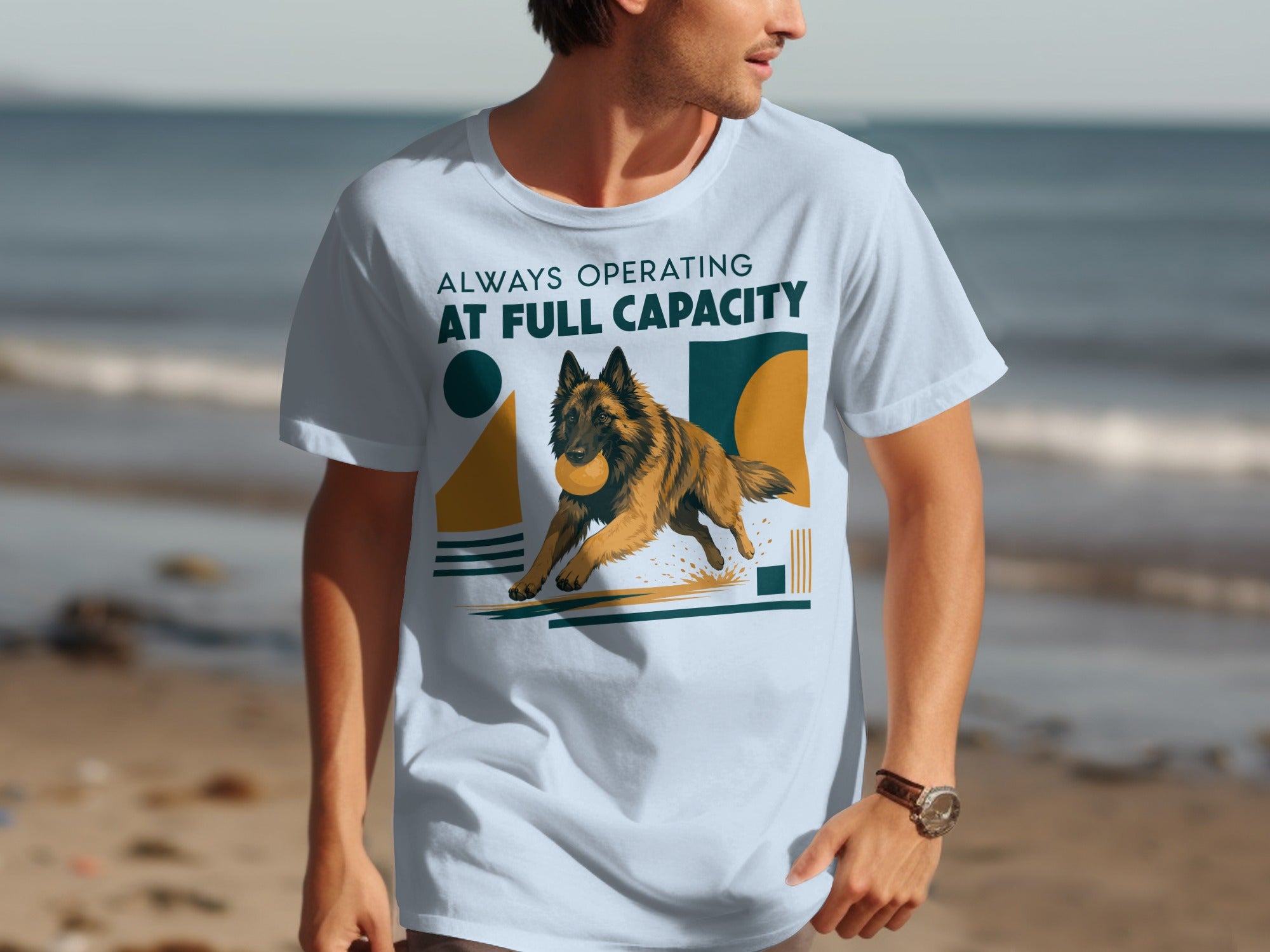 Light blue t-shirt with a running dog graphic and "ALWAYS OPERATING AT FULL CAPACITY" text.
