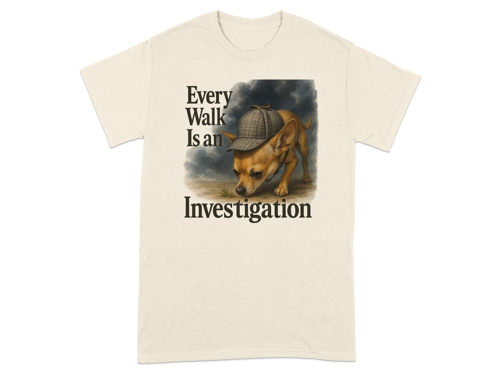 Beige t-shirt with text "Every Walk Is an Investigation" and a dog in a deerstalker hat.