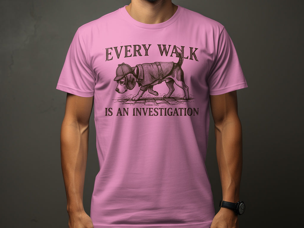 Pink t-shirt with beagle wearing hat and text "EVERY WALK IS AN INVESTIGATION".