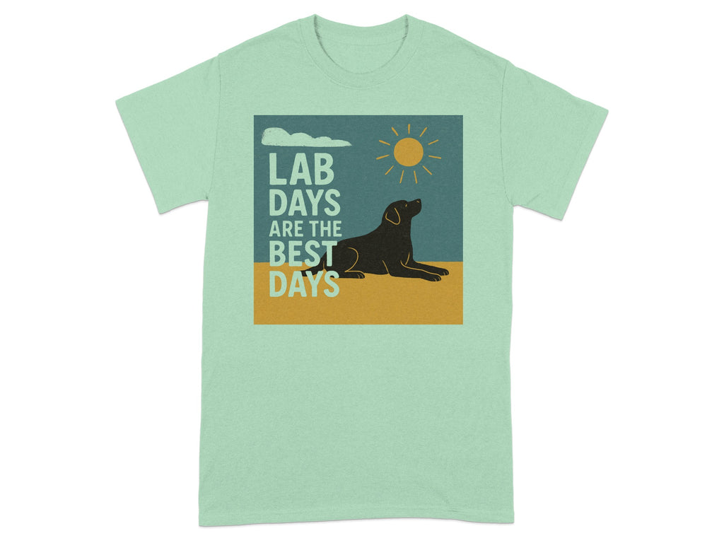 Mint green t-shirt with graphic: black dog, sun, clouds, text "LAB DAYS ARE THE BEST DAYS".