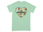Mint green t-shirt with a heart-shaped collage of dogs and paw prints.