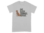Gray t-shirt with text "EAT. SLEEP. ZOOMIES. REPEAT." and a dog icon.