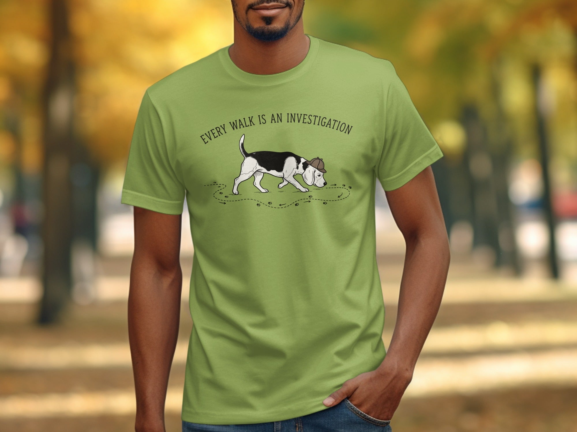 Light green t-shirt with a beagle sniffing the ground, text "Every walk is an investigation".