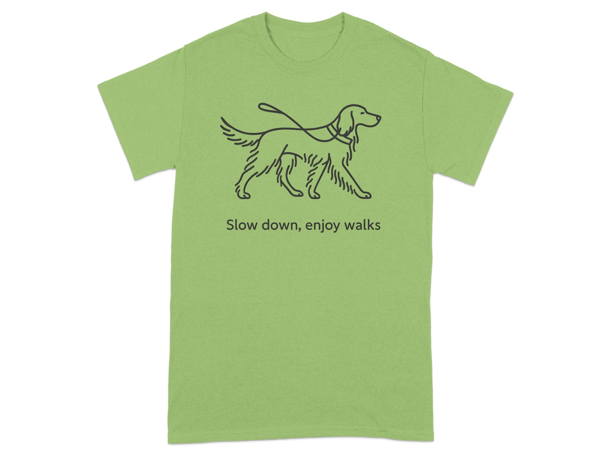 Light green t-shirt with a line drawing of a dog on a leash and text "Slow down, enjoy walks."