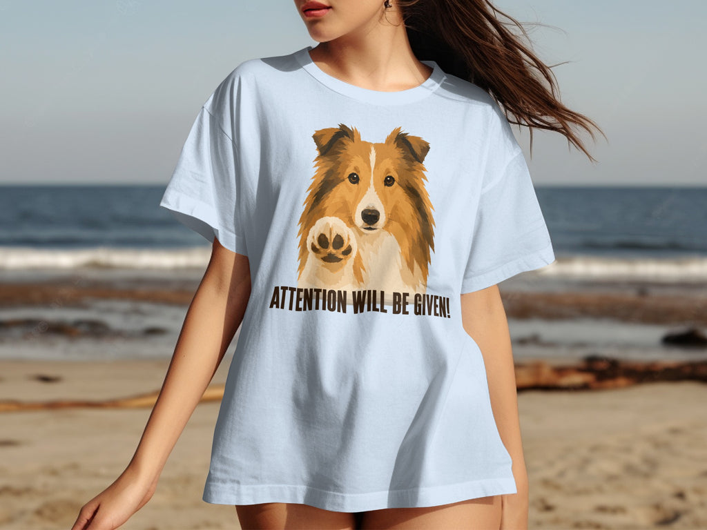 Light blue t-shirt with a Shetland Sheepdog and "ATTENTION WILL BE GIVEN!" text.