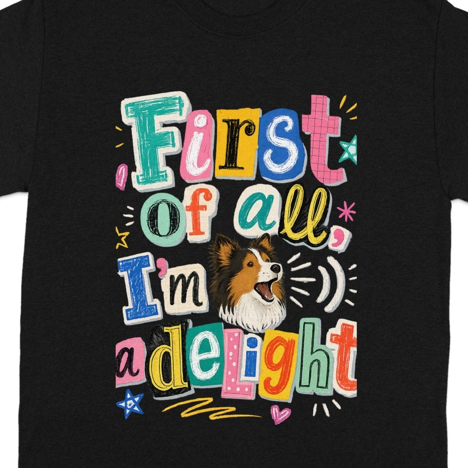 Black t-shirt with dog graphic and text "First of all, I'm a delight."