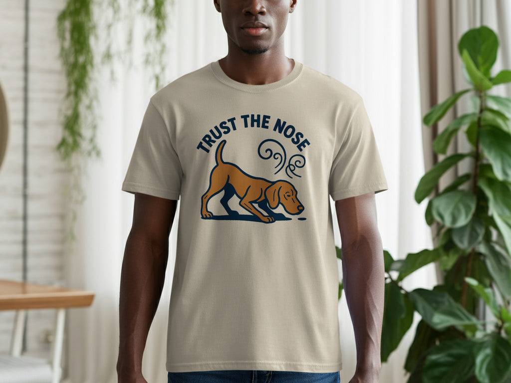 Tan t-shirt with cartoon dog and text "TRUST THE NOSE".
