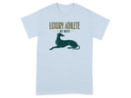 Light blue t-shirt with "LUXURY ATHLETE AT REST" text and a greyhound silhouette.