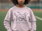 Light pink sweatshirt with a line drawing of a dog and the text "Slow down, enjoy walks".