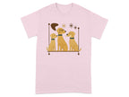 A pink t-shirt with a graphic of three cartoon dogs sitting on a shelf, one with glasses.
