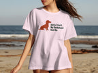 Pink t-shirt with a dachshund illustration and "Sorry I Can't. My Dachshund Said No." text.